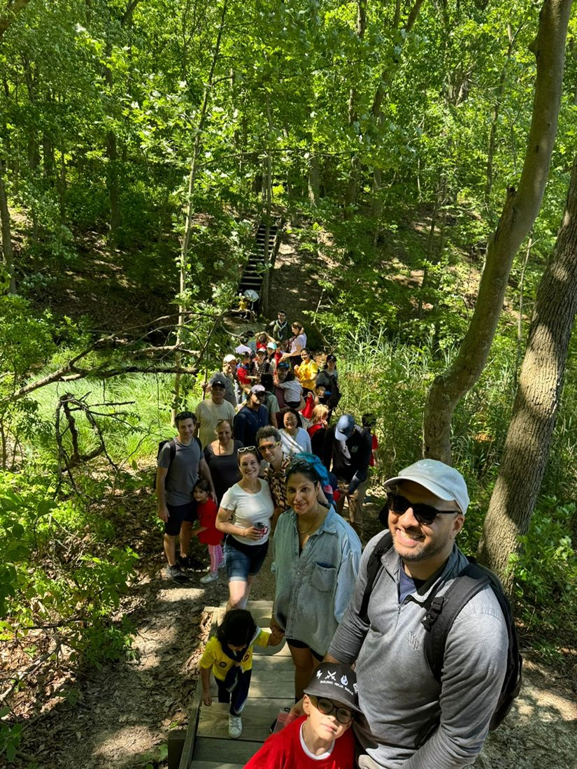 The group hiking a forest trail